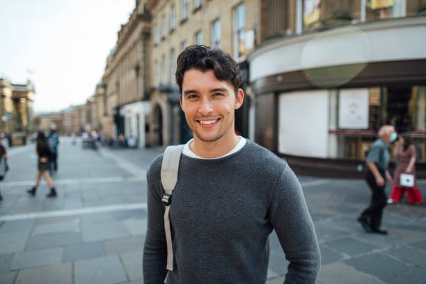 Young man smiling in an urban environment